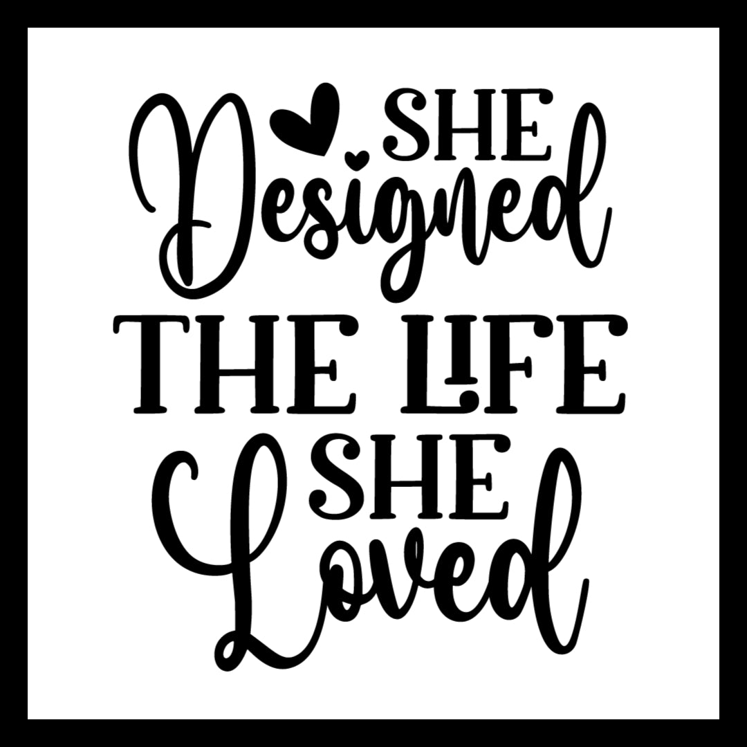 Black text 'SHE DESIGNED THE LIFE SHE LOVED' on a white background with several black hearts.