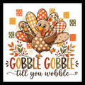 'Gobble Gobble till you wobble' in multi-colored text, with an image of a multi-colored turkey with fall-colored accents, on a white background.