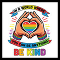 Colorful graphic with hands forming a heart shape with rainbow colors, surrounded by the following multi-colored text 'in a world where you can be anything, be kind' on a white background.