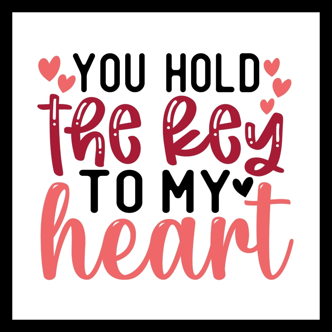 'YOU HOLD THE KEY TO MY HEART' IN BLACK, DARK AND LIGHT PINK TEXT WITH BLACK AND PINK HEARTS ON A WHITE BACKGROUND.