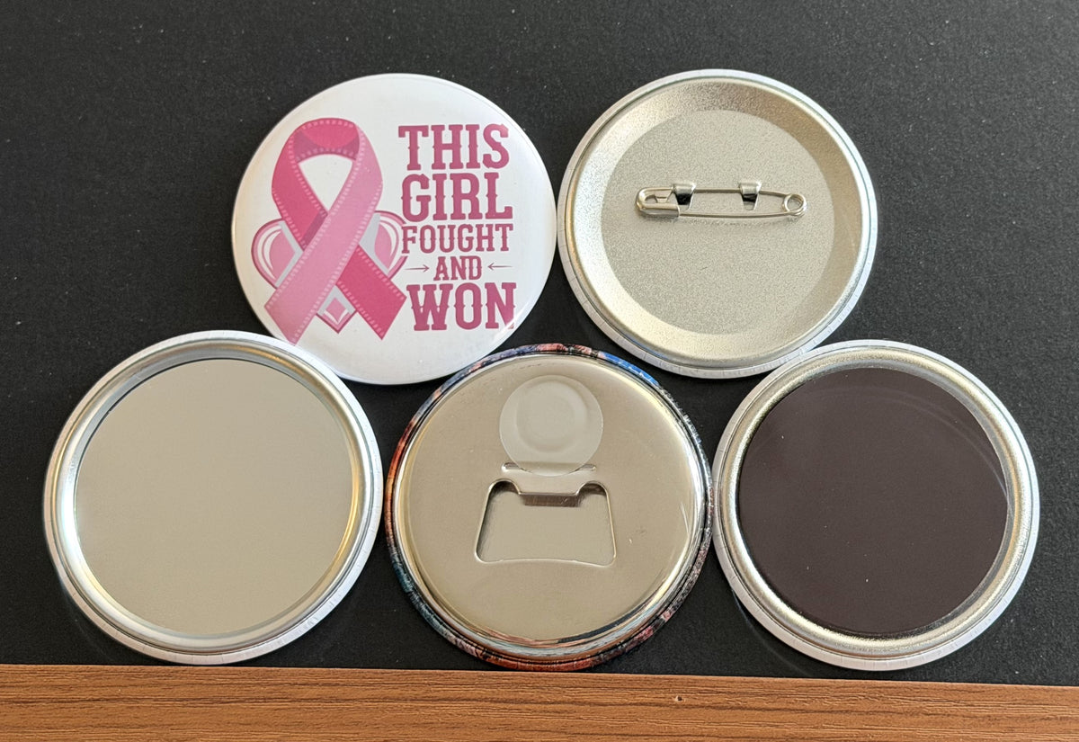 Round white magnet with the message 'This girl found and won'' in pink text with a pink breast cancer ribbon.  Also in the photo are the four options available for this magnet which include a pin back button, pocket mirror, magnetic bottle opener and magnet.  This image was photographed on a black background.