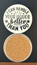 Round white drink coaster with cork backing with 'I can handle your liquor better than you' in black text, with black stars, photographed on a black background.
