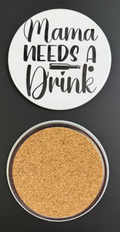 Round white drink coaster with cork backing with 'Mama Needs a Drink' in text black text, photographed on a black background.